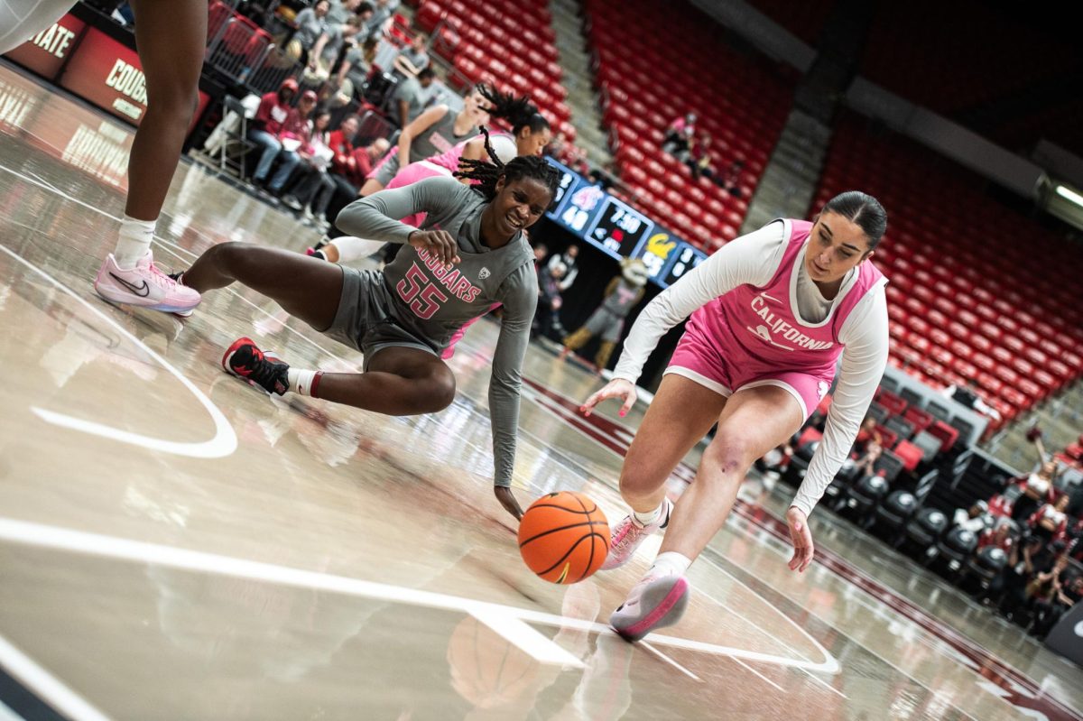 Bella Murekatete falls after losing possession of the ball, Feb. 9, in Pullman, Wash.