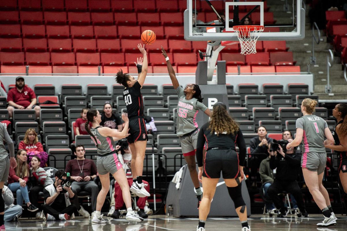 Bella Murekatete leaps into the air to contest a Stanford shot during the first half of an NCAA womens basketball game, Feb. 11, in Pullman, Wash.
