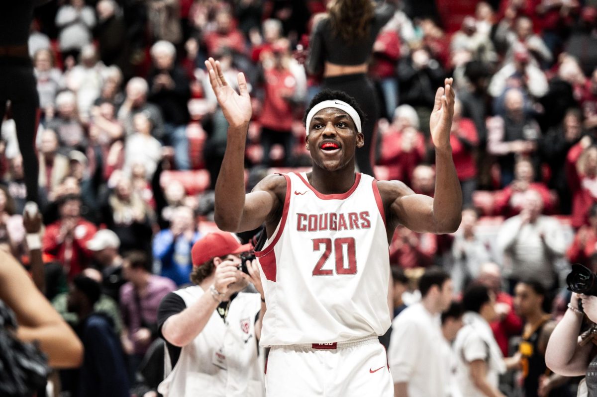 Rueben Chinyelu thanking the crowd after showing out for the Cougs win over Cal, Feb. 15, in Pullman, Wash.