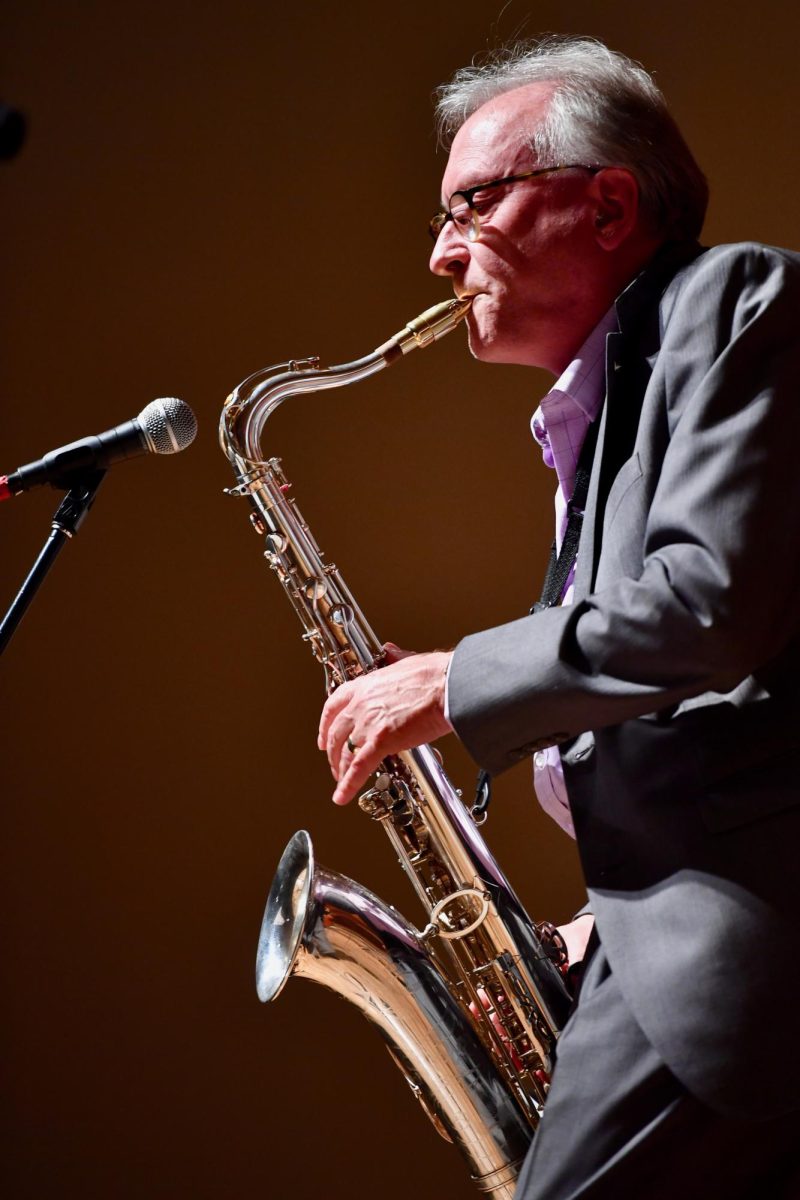 Greg Yasinitsky playing a saxophone.