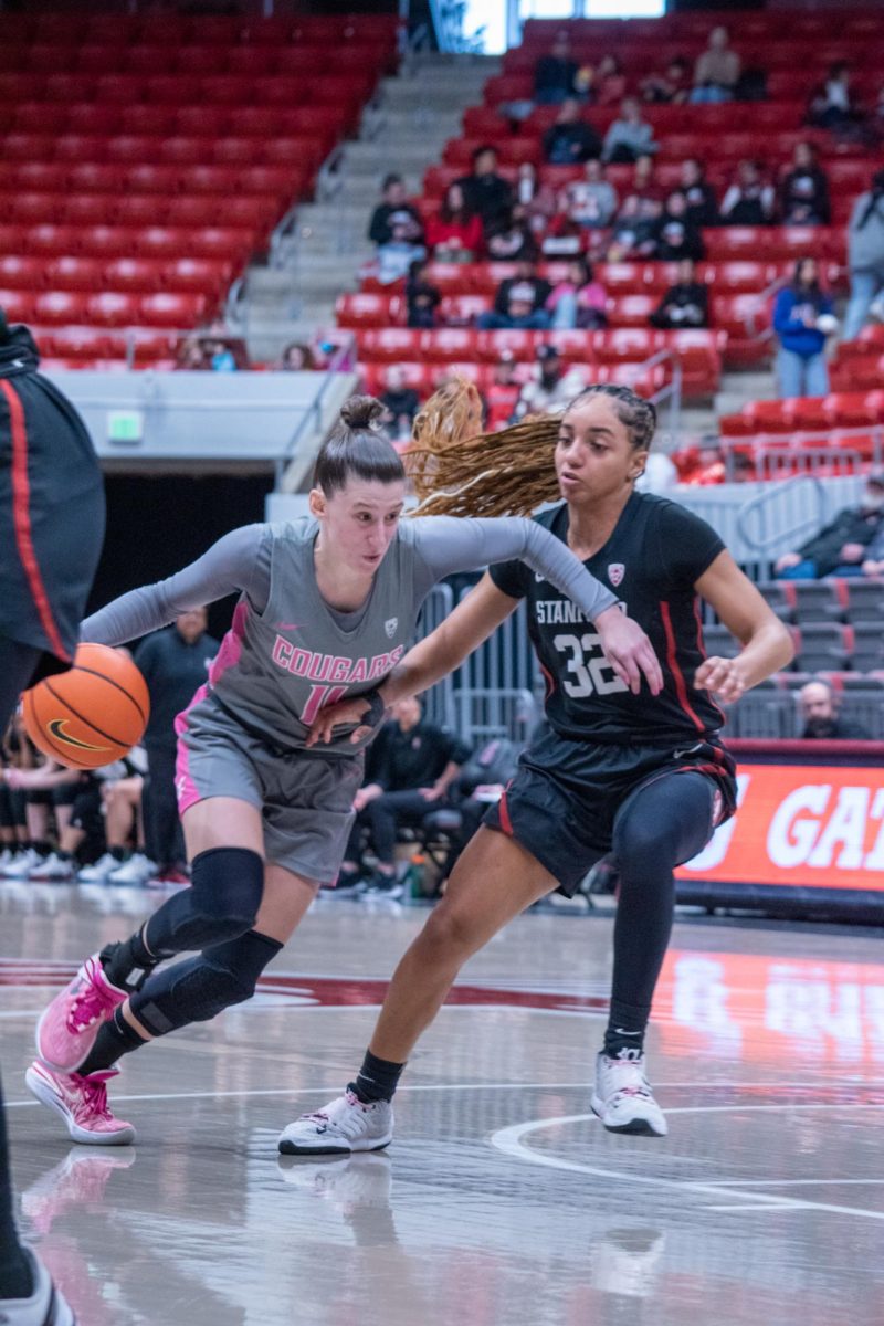 WSU women’s basketball player Astera Tuhina dribbles the ball down the court during an NCAA women’s basketball game against Stanford, Feb. 11, 2024, in Pullman, Wash.