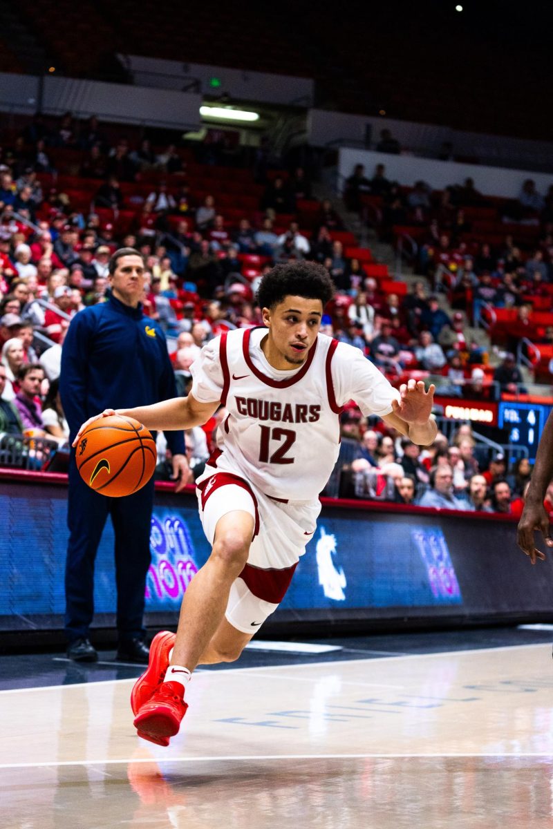 Guard Isaiah Watts dribbles up the court in an NCAA mens basketball game against Cal, Feb. 15, 2024, in Pullman, Wash. 