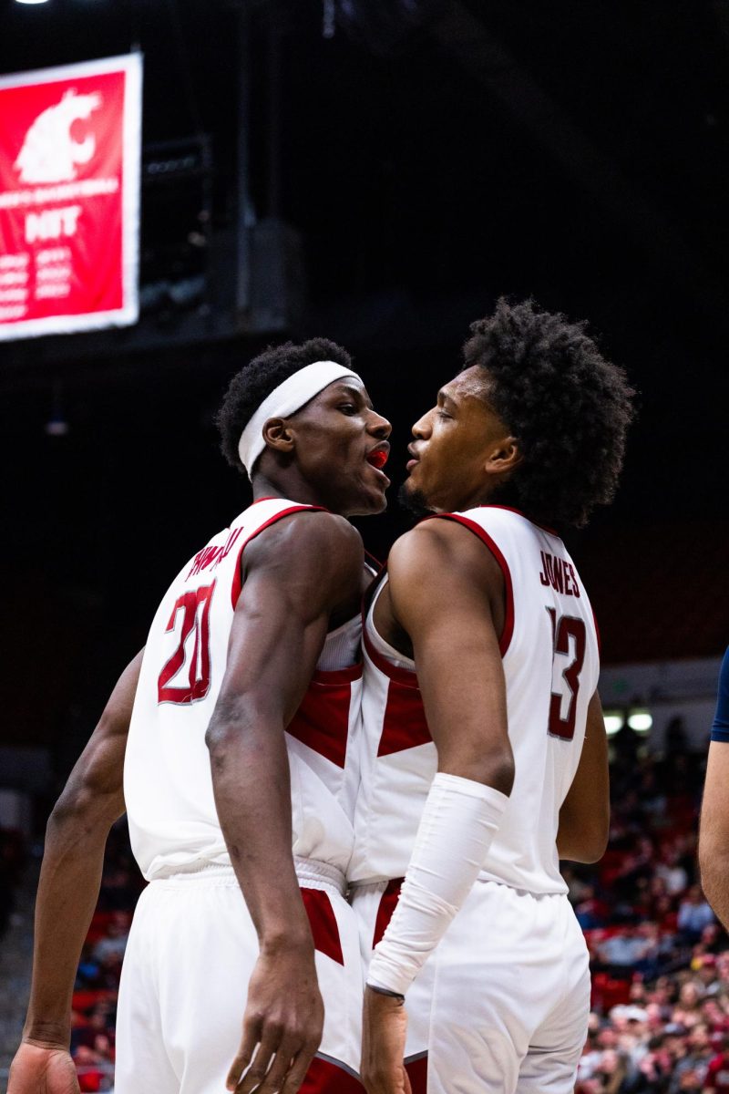 Forward Isaac Jones and center Rueben Chinyelu chest bump in celebration during an NCAA mens basketball game against Cal, Feb. 15, 2024, in Pullman, Wash. 
