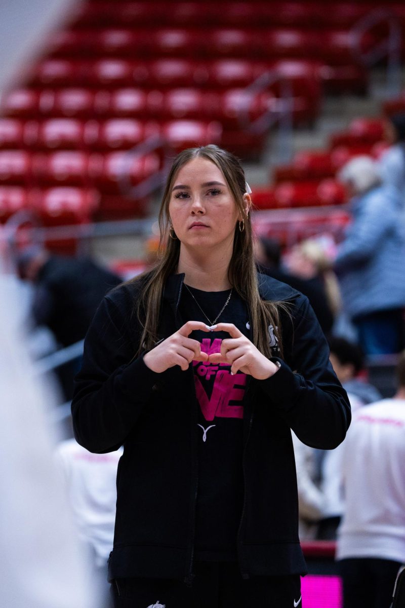 WSU guard Johanna Teder holds a heart hand symbol up to the crowd after losing to Cal 66-59, Feb. 9, 2024, in Pullman, Wash.