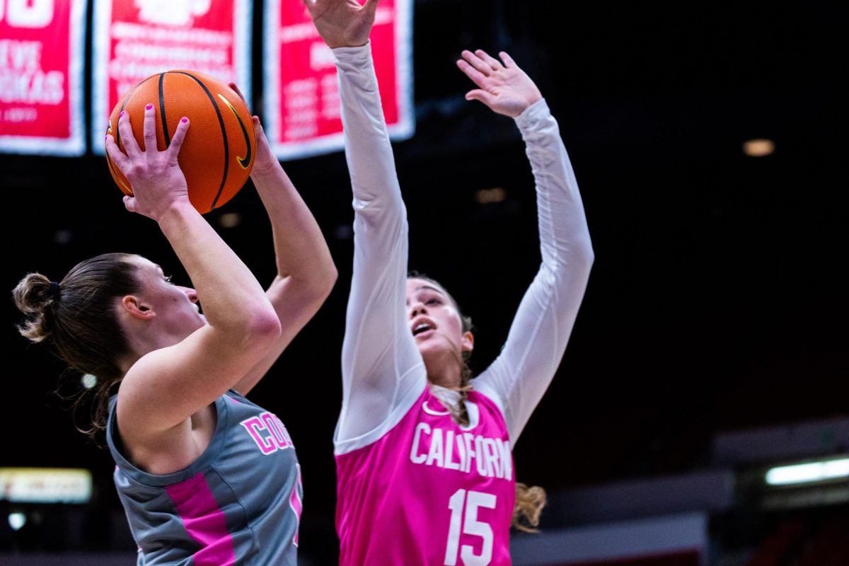 WSU guard Astera Tuhina goes to shoot past a Cal defender in an NCAA womens basketball game, Feb. 9, 2024, in Pullman, Wash.