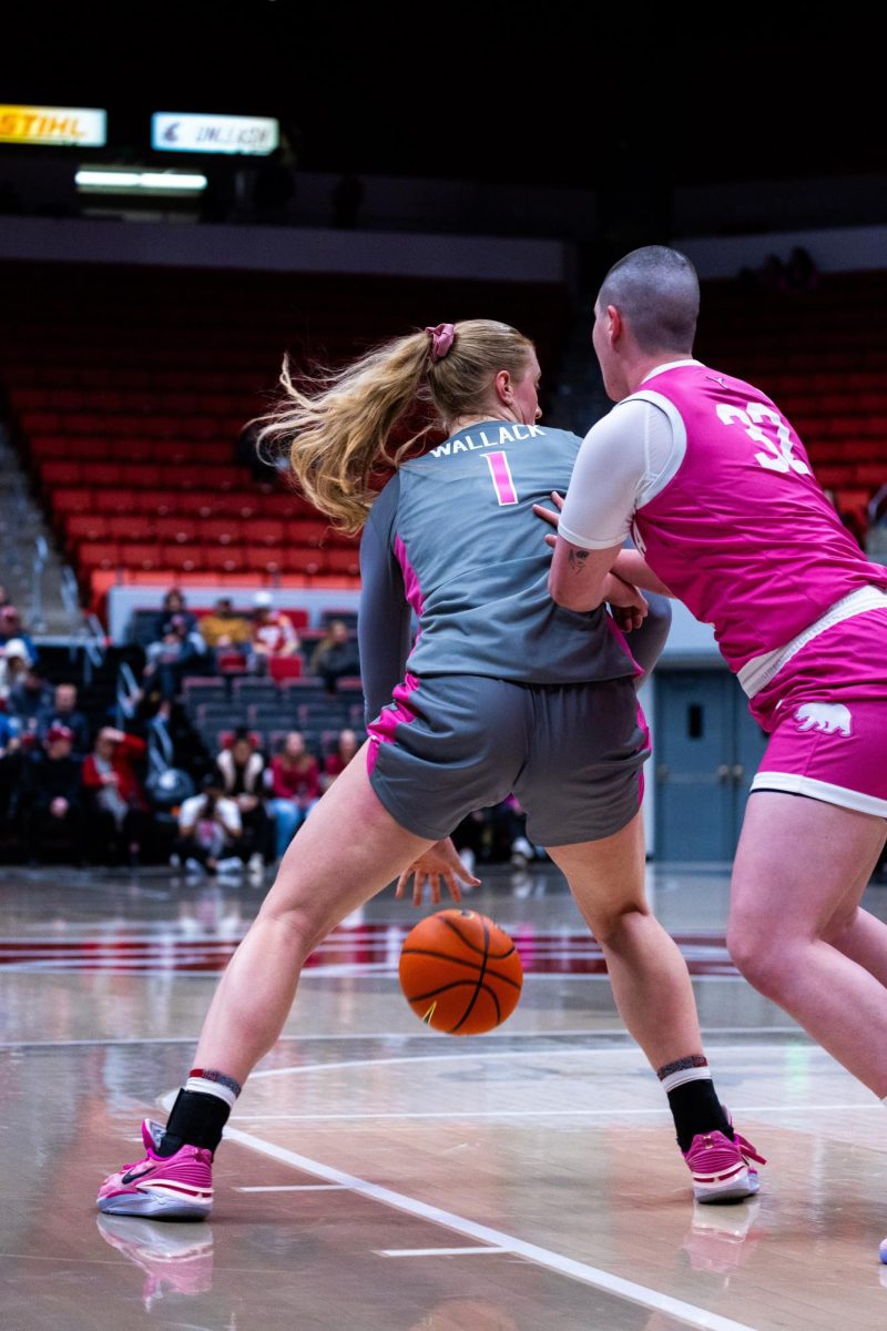 WSU guard Tara Wallack dribbles to keep the ball away from a Cal defender during an NCAA womens basketball game, Feb. 9, 2024, in Pullman, Wash.