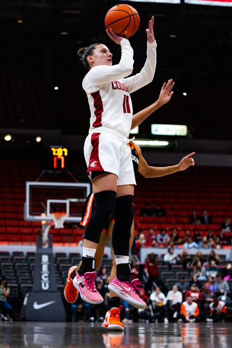 WSU guard Astera Tuhina shoots for three during an NCAA womens basketball game against Oregon State, Feb. 23, 2024, in Pullman, Wash.