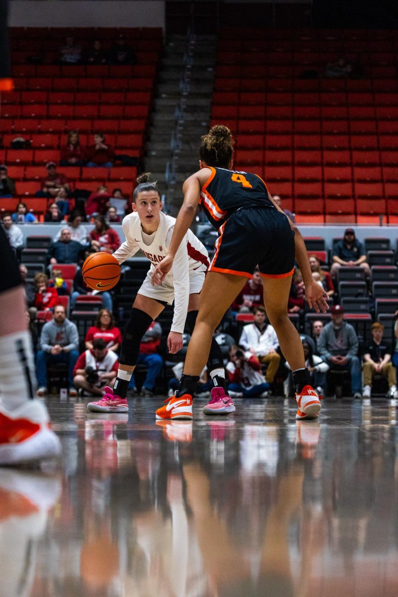 WSU guard Astera Tuhina dribbles to keep the ball away from an Oregon State defender in an NCAA womens basketball game, Feb. 23, 2024, in Pullman, Wash.