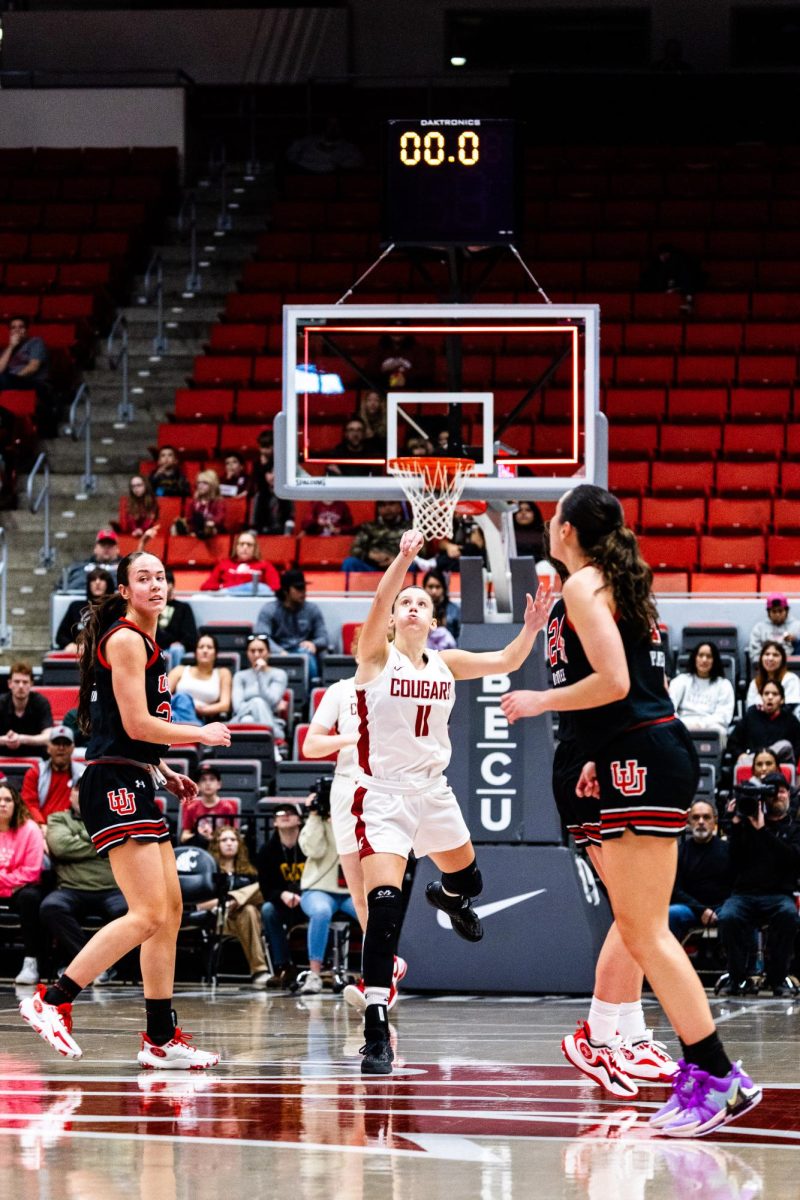 WSU guard Astera Tuhina launches and makes a half-time buzzer-beater during an NCAA womens basketball game against Utah, Feb. 4, 2024, in Pullman, Wash.