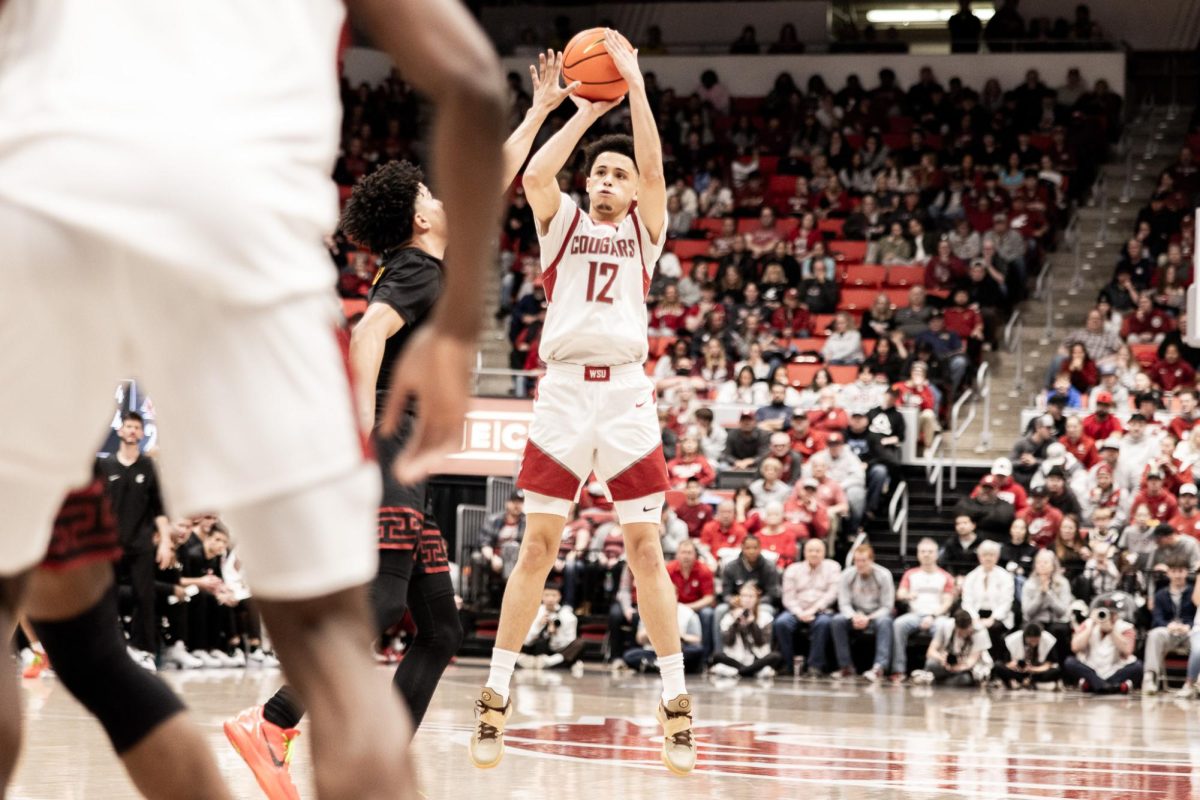 Isaiah Watts shoots from downtown against the Trojans, Feb. 29, in Pullman, Wash