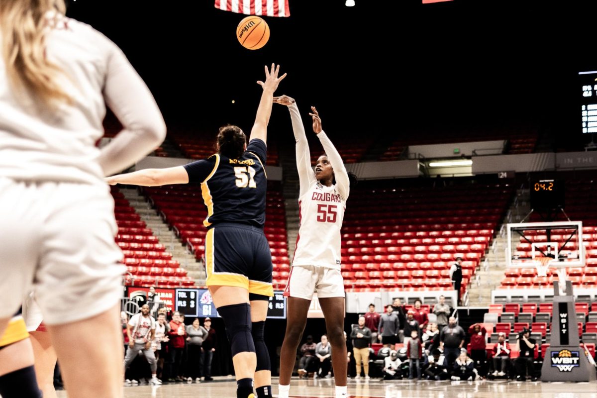 Bella Murekatete shoots from the top of the key to the Cougs a lead in the waning seconds of the game, March 29, in Pullman, Wash. 