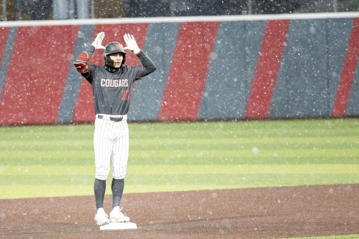 Max Hartman celebrates toward his dugout after his leadoff double against Rhode Island, March. 1 2024. 