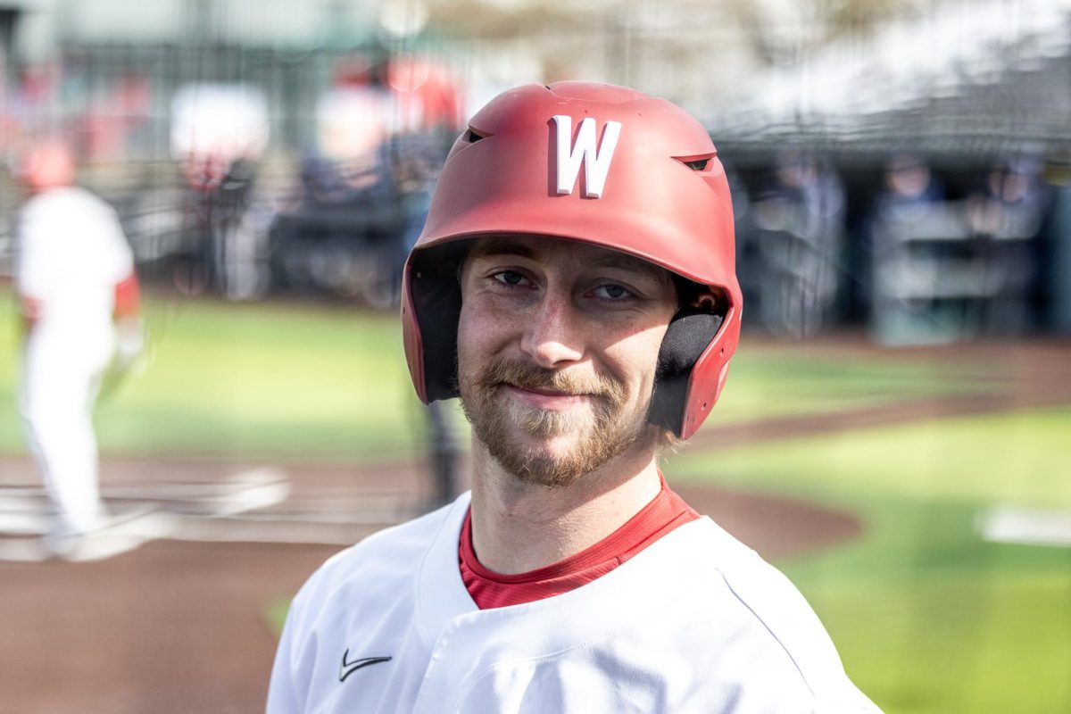 Cole Cramer smiles while on the on-deck circle, March 2, in Pullman, Wash.