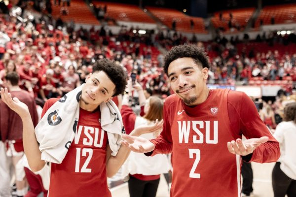 Myles Rice and Isaiah Watts shrug after taking down UCLA, March 2, in Pullman, Wash. 