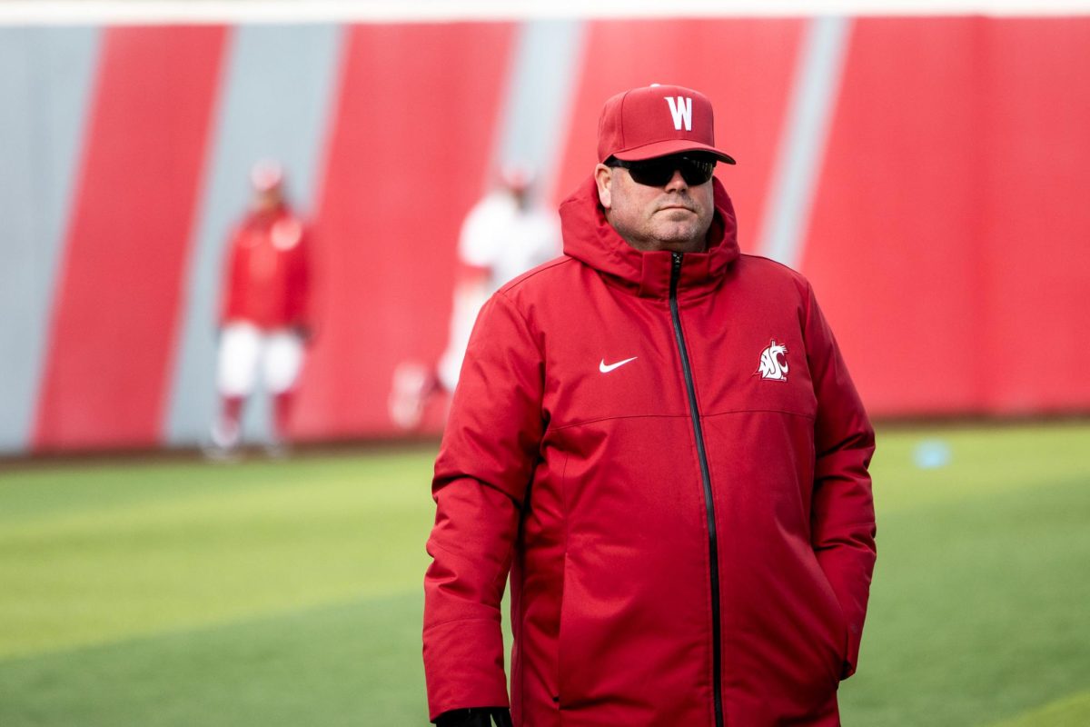 Head coach Nathan Choate walking back to the dugout during team warmups, March 3, 2024 in Pullman, Wash. 