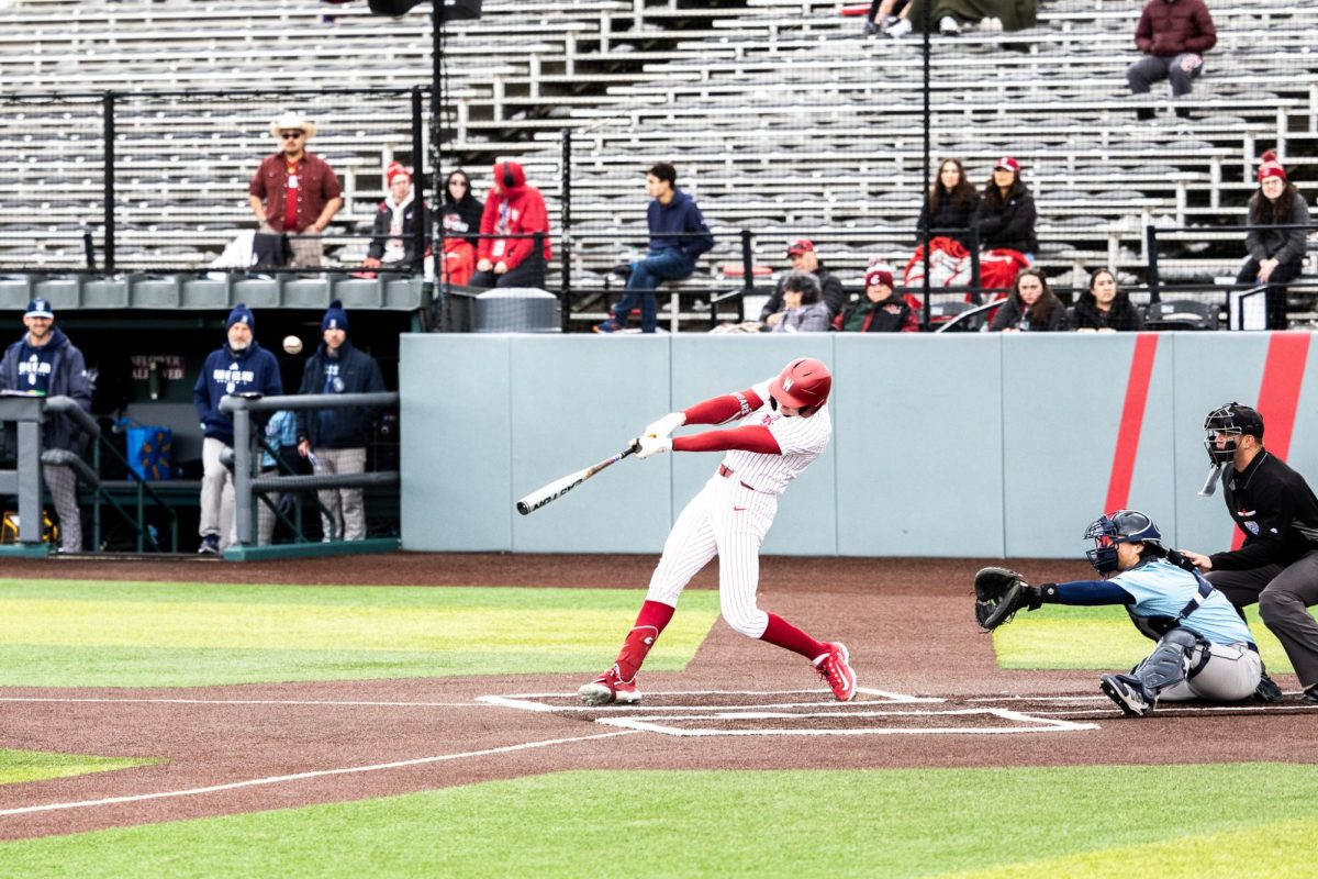 Outfielder Casen Taggart tags a ball to give it a ride, March 3, in Pullman, Wash. 