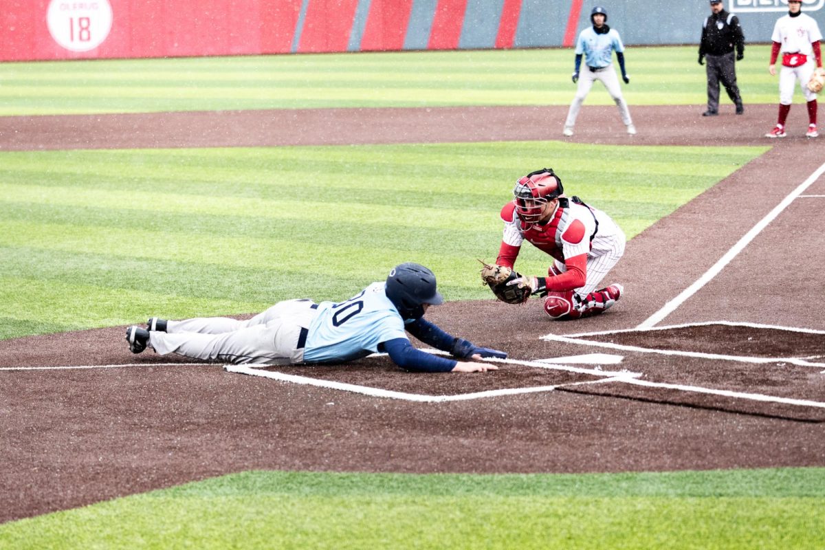 Brody Levin slides into home for the go-ahead run in the top of the ninth, March 3, in Pullman, Wash. 