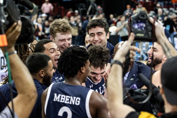 The Yale team is all smiles after completing the upset over Auburn, March 22, in Spokane, Wash.