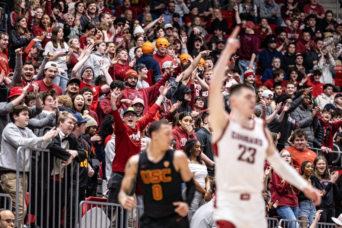 SU students celebrate after WSU forward Andrej Jakimovski makes a 3-pointer during an NCAA men’s basketball game against USC, Feb. 29, 2024, in Pullman, Wash.