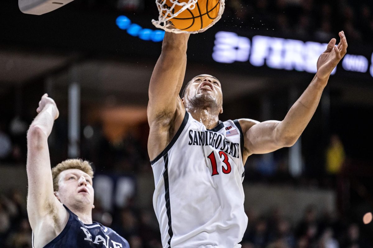 SDSU+forward+Jaedon+LeDee+dunks+the+ball+during+a+second-round+match+against+Yale%2C+March+24%2C+2024%2C+in+Spokane%2C+Wash.