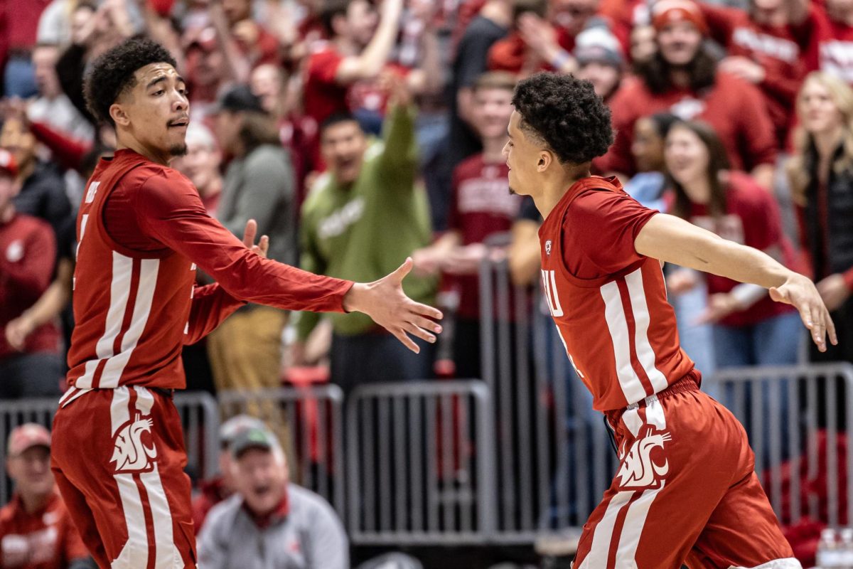 WSU+guards+Myles+Rice+and+Isaiah+Watts+high-five+each+other+after+a+3-pointer+during+an+NCAA+men%E2%80%99s+basketball+game+against+UCLA%2C+March+2%2C+2024%2C+in+Pullman%2C+Wash.
