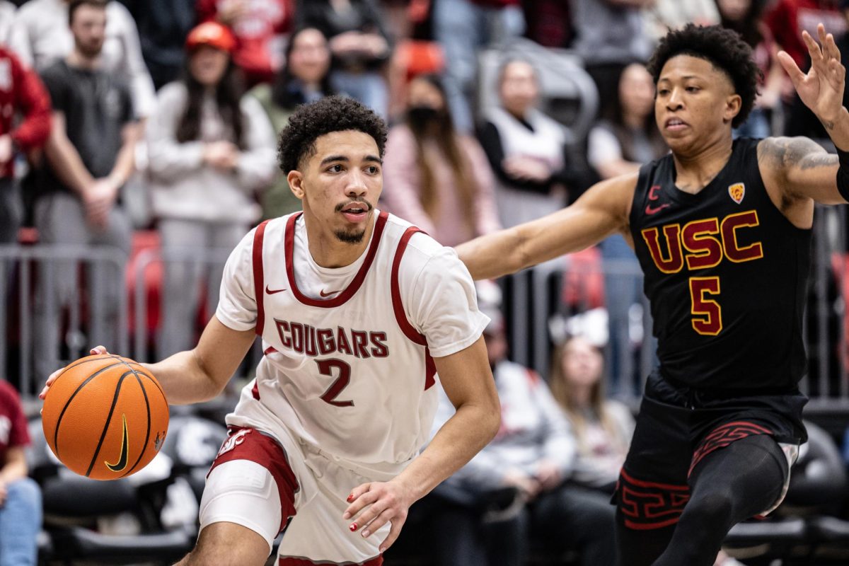 WSU guard Myles Rice dribbles toward the basket during an NCAA men’s basketball game against USC, Feb. 29, 2024, in Pullman, Wash.