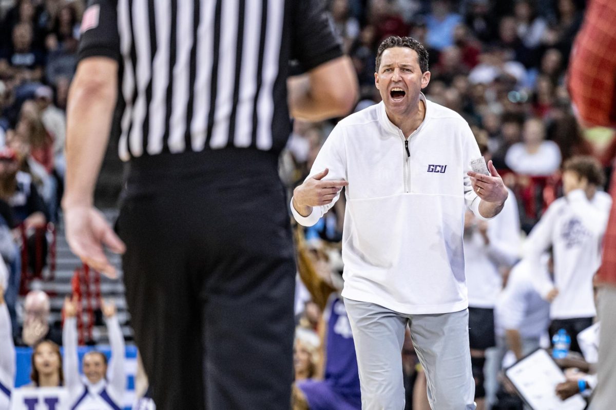 GCU head coach Bryce Drew speaks with an official during a second-round match against Alabama, March 24, 2024, in Spokane, Wash.