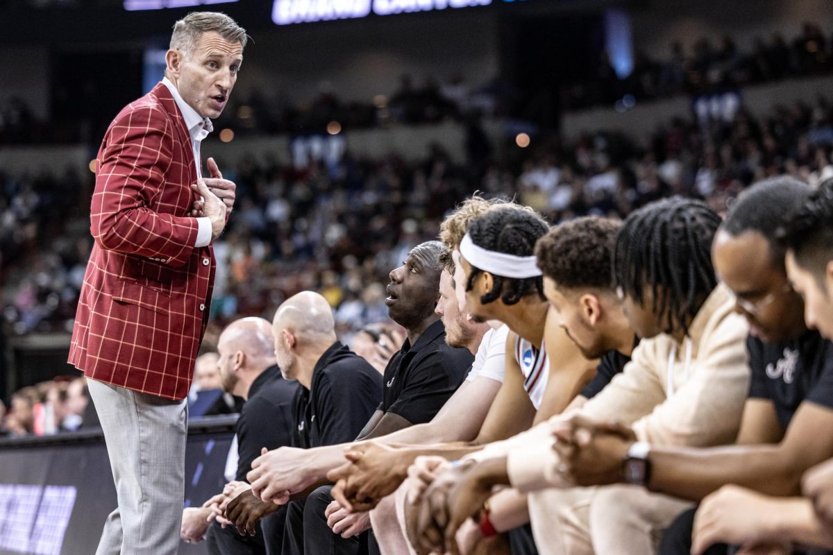Alabama head coach Nate Oats instructs his bench to remain seated during a second-round match against GCU, March 24, 2024, in Spokane, Wash. Officials threatened to remove Oats if the team did not comply.