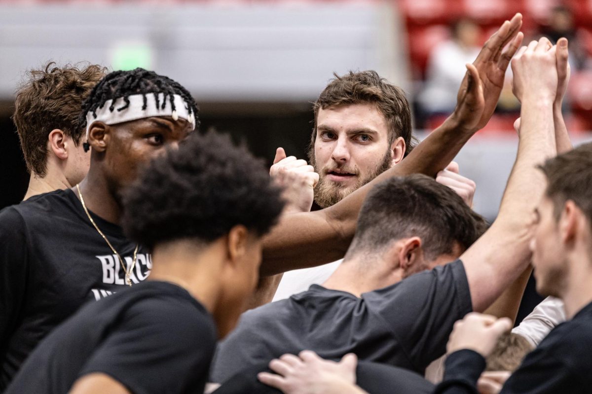 WSU men’s basketball players huddle up before an NCAA men’s basketball game against USC, Feb. 29, 2024, in Pullman, Wash.
