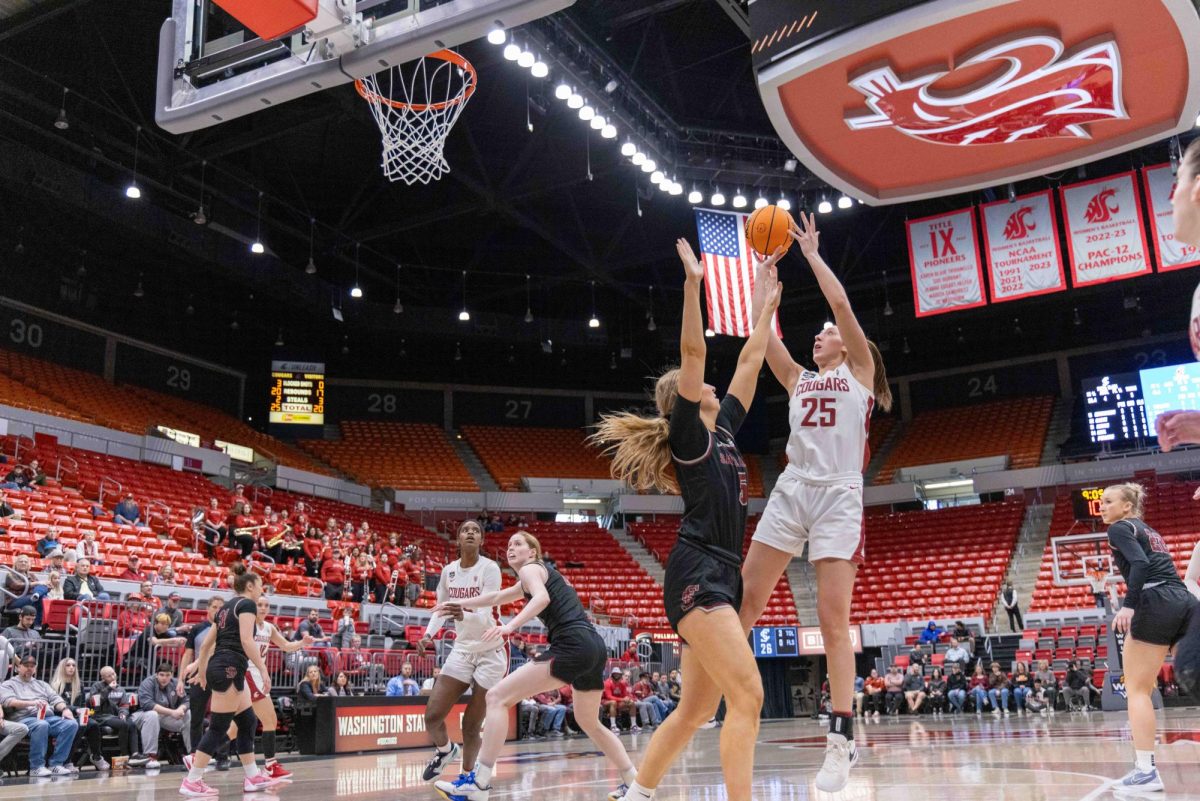 Cougar Forward Beyonce Bea going for a jump shot while being guarded by Santa Clara’s Forward Olivia Pollerd, March 24 in Pullman, Wash.