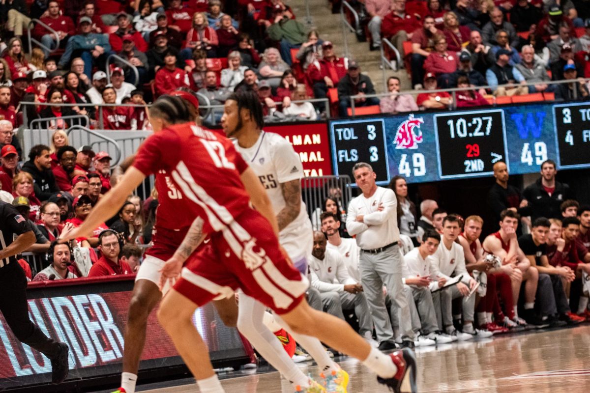 WSU head coach Kyle Smith and his staff and bench look on as the Cougs battle the Huskies in the Apple Cup, an NCAA basketball game between WSU mens basketball and UW, March 7 in Pullman, Wash.