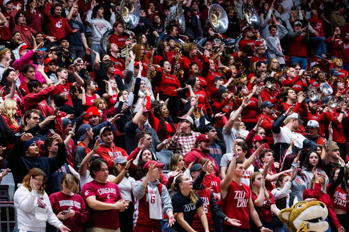 WSU fans do the jaws clap during an NCAA mens basketball game against USC, Feb. 29, 2024, in Pullman, Wash. 