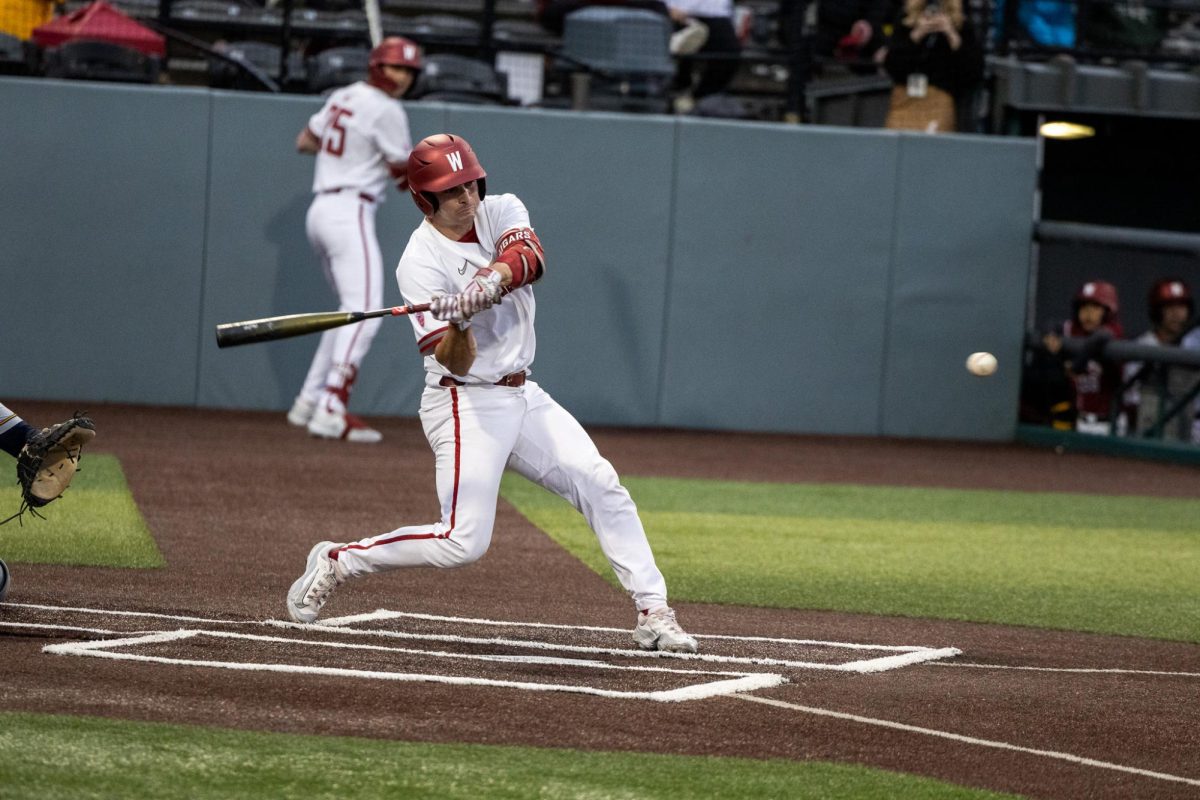 WSU catcher Jacob Morrow swings at a baseball during the Cougs loss to Cal Friday, April 12, in Pullman, Wash. 