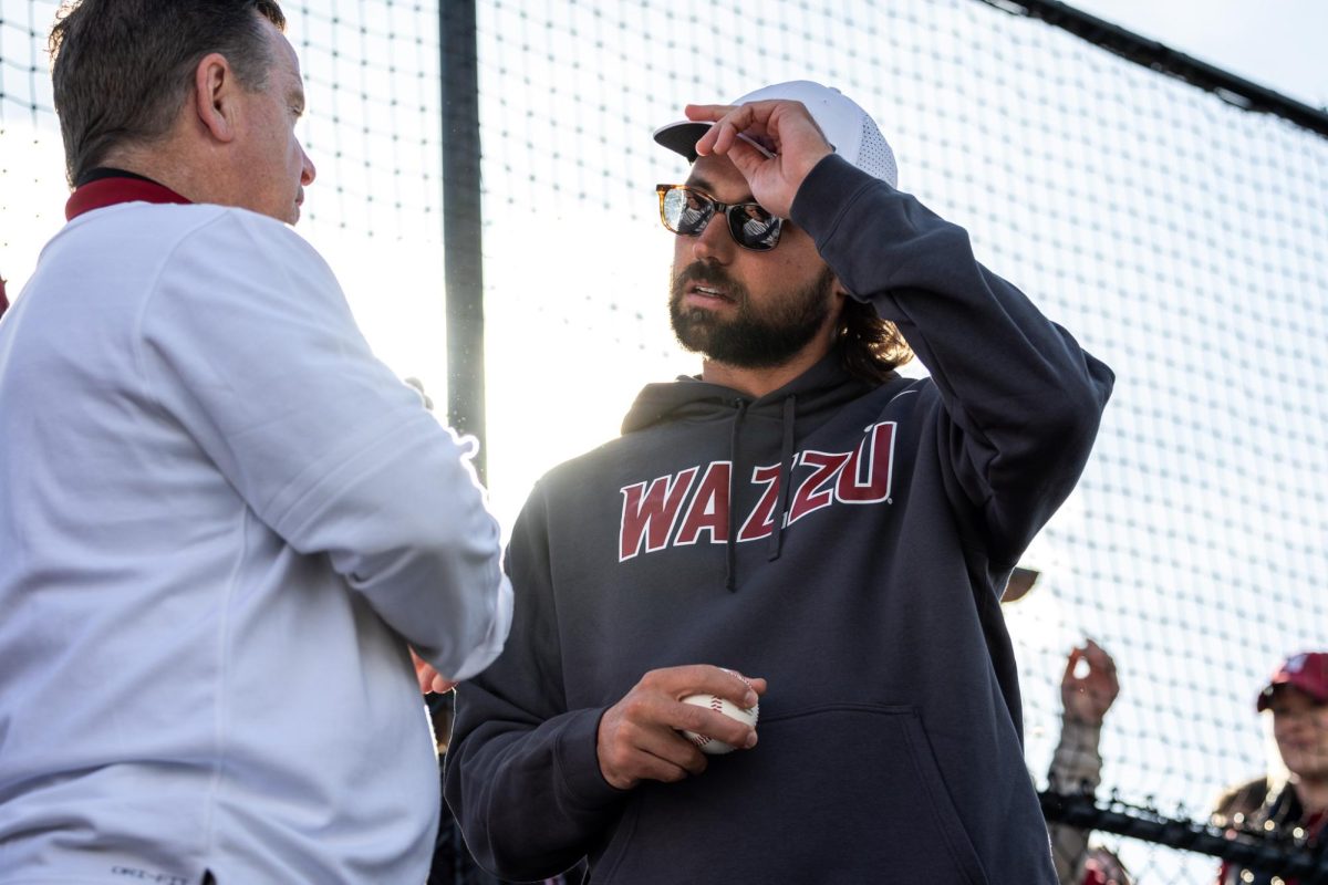 Gardner Minshew talking with WSU S.I.D. Bill Stevens before throwing out the first pitch, April 26, in Pullman, Wash.