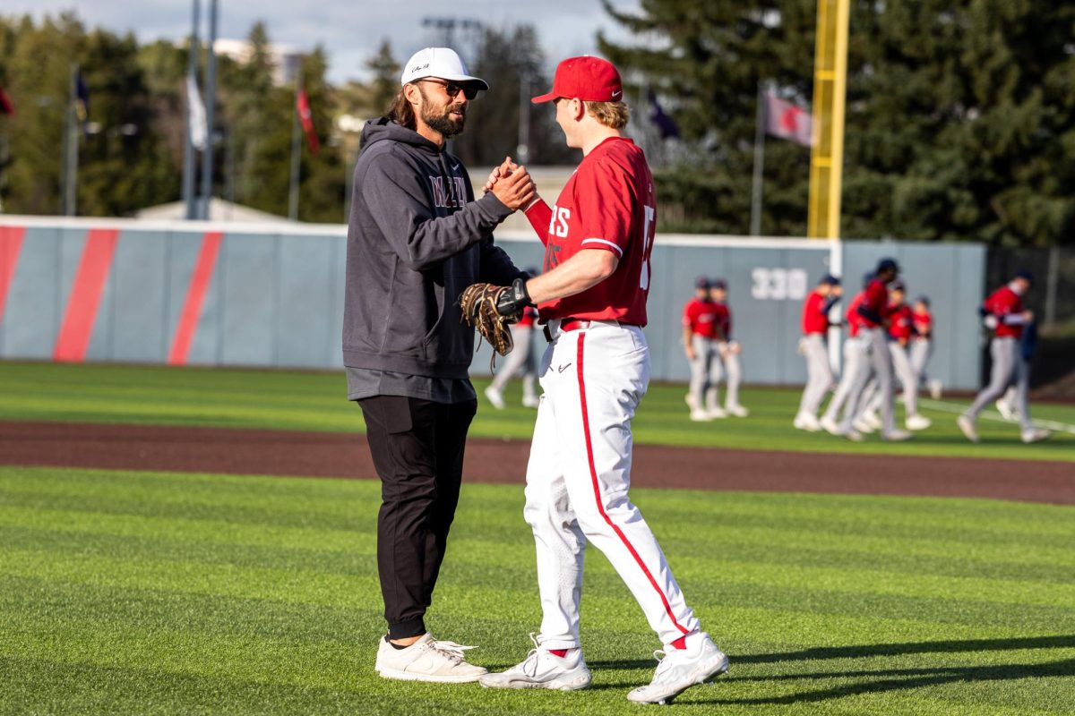 Gardner Minshew throws out the first pitch of the WSU baseball game, April 26, in Pullman, Wash. 