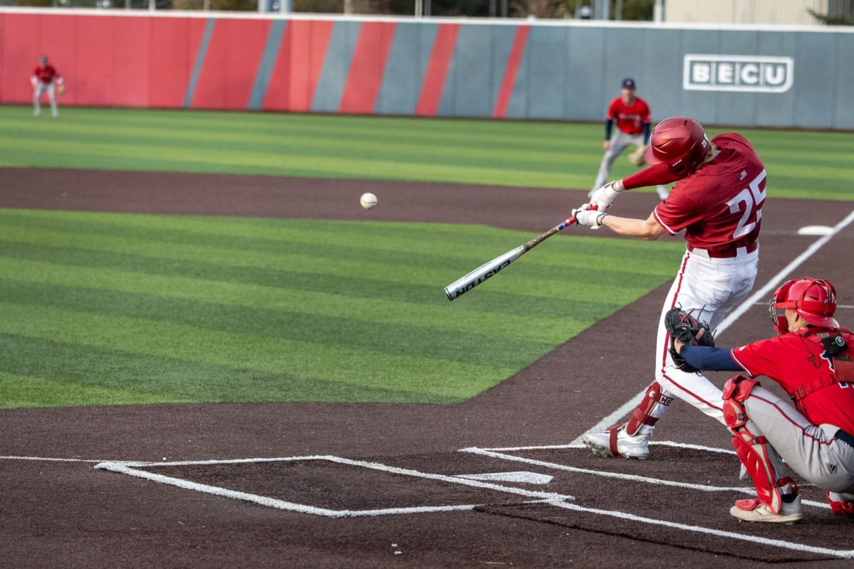 WSU outfielder Casen Taggart makes solid contact with a pitch to send the ball to the outfield grass, April 26, in Pullman, Wash. 