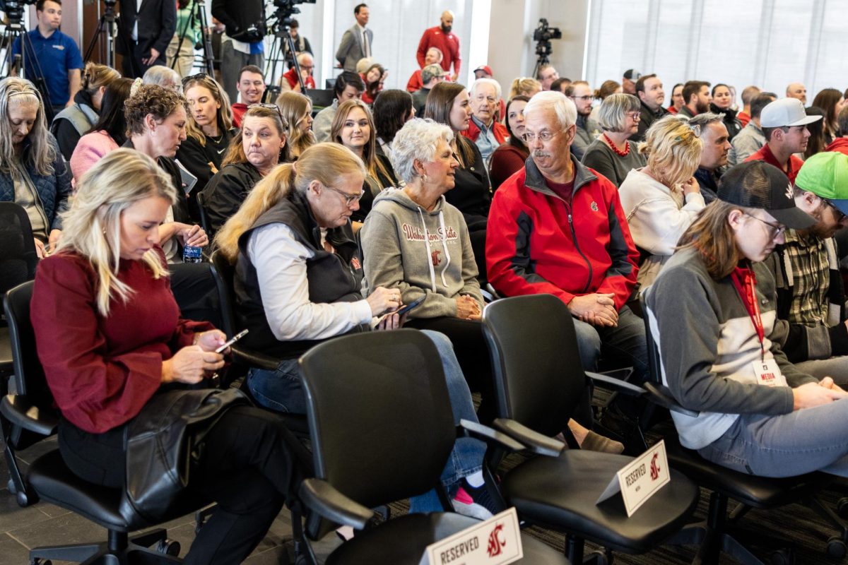 A full room of Pullman residents, media and students await new MBB head coach David Rileys arrival, April 4, in Pullman, Wash. 
