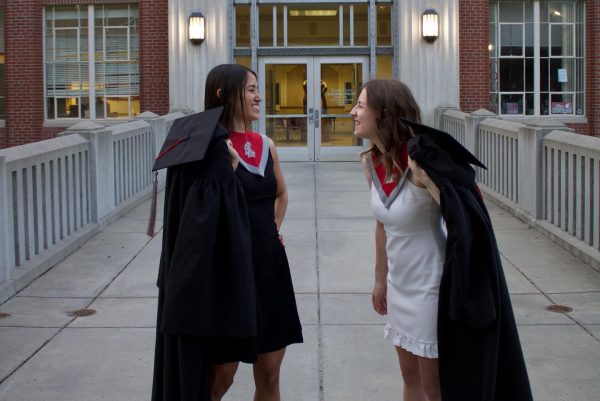 Amanda Neumann and Jazzlyn Rokosz before graduating with their bachelors degrees last year.