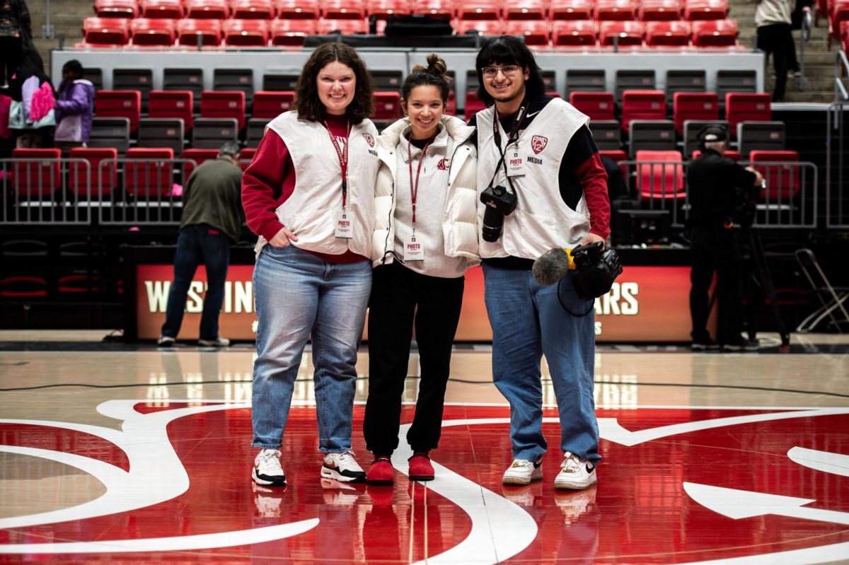 Carly Ostrem (L), Addi Wong (M) and Cristian Gonzalez (R) pose at midcourt after a WSU MBB game, Feb. 9, in Pullman, Wash. 