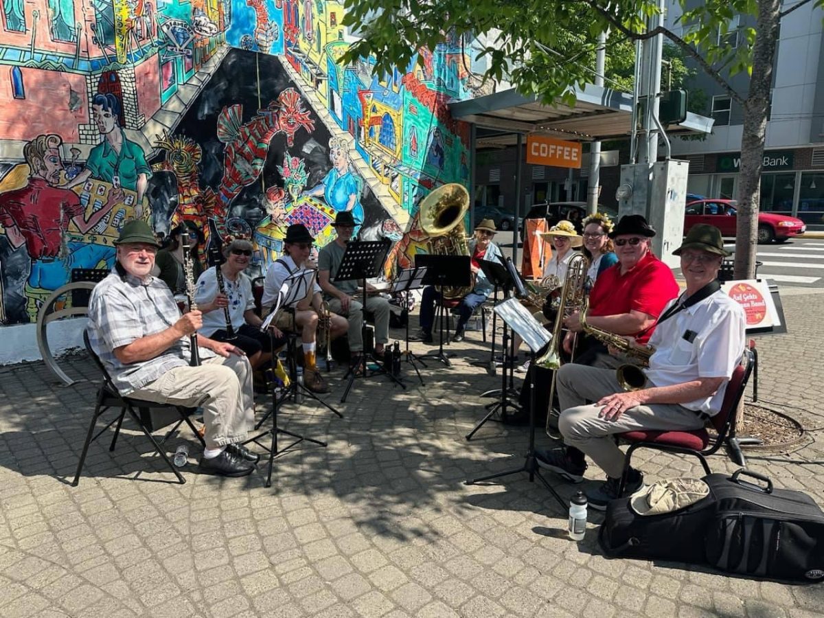 Community Band of the Palouse performs outdoors in Downtown Pullman