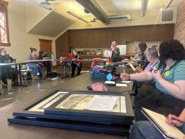 Gail Cochran sharing her artwork at a Palouse Women Artists meeting March 17, 2024, in Moscow, Idaho.