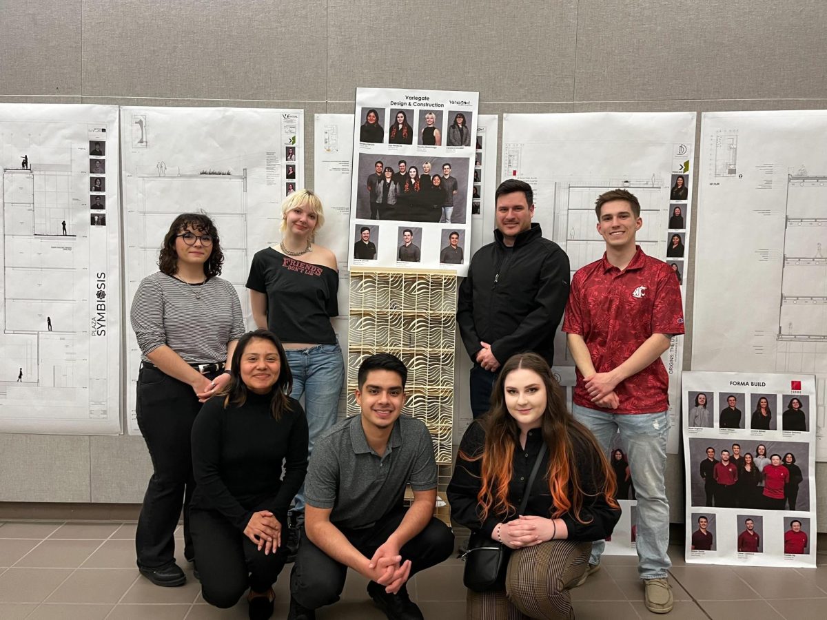 Design+editor+Dorothy+Greenhalge+with+their+capstone+group+after+presenting+their+final+design+last+April.