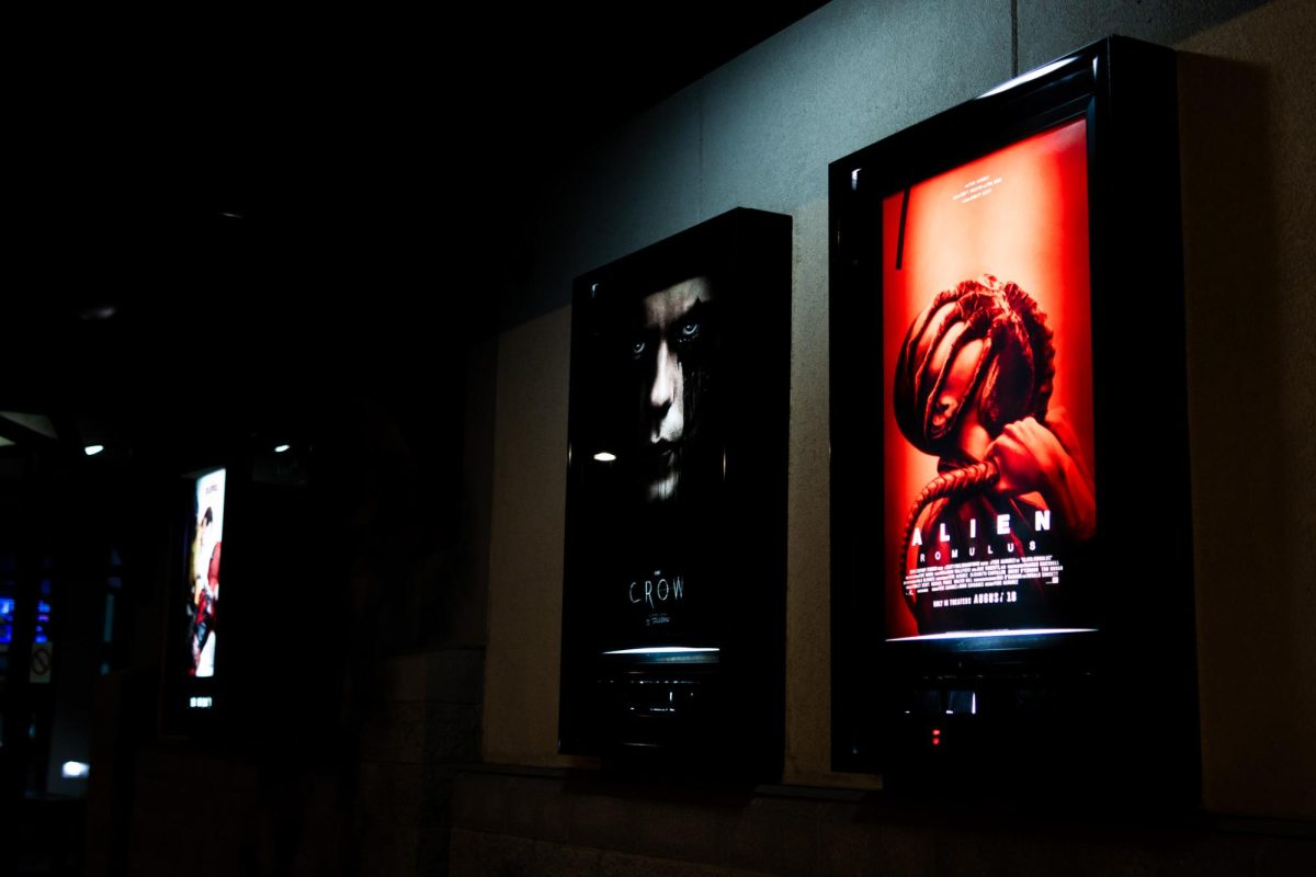 Posters hanging outside Pullman's movie theater showcasing some of the last new movies to show before the theater's closure, Aug. 20, in Pullman, Wash. 