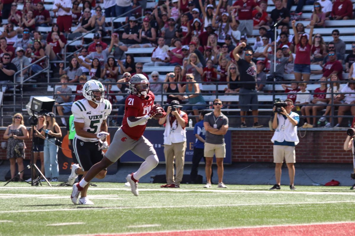 WSU Running back Wayshawn Parker runs away from defenders in a 70-30 win over Portland State at Gesa Field Saturday, August 31, 2024.