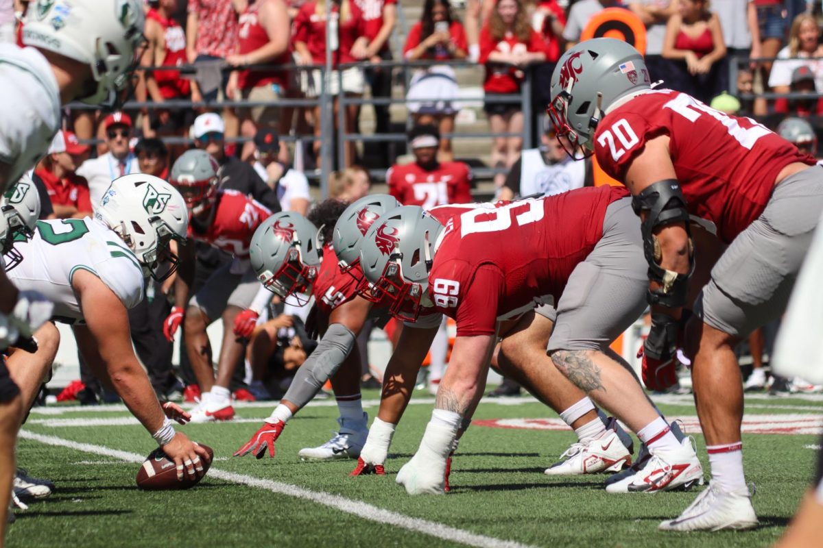 Defensive lineman Nusi Malani (15), Bryson Lamb (99) and Quinn Roff (20) lineup opposite Portland State offensive lineman in a football game against Portland State at Gesa Field in Pullman, WA Saturday, August 31, 2024.