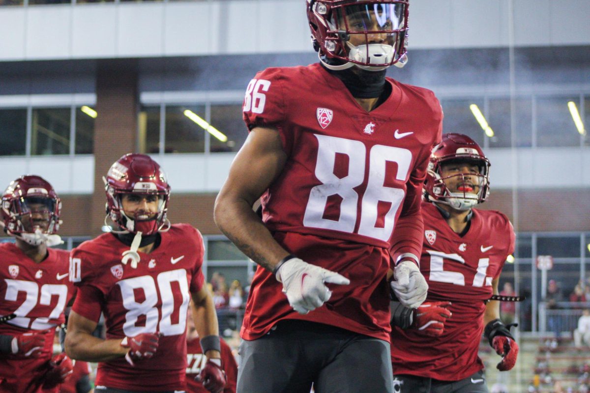 WSU football players run onto the field in a week four matchup against SJSU at Gesa Field in Pullman, Wash.