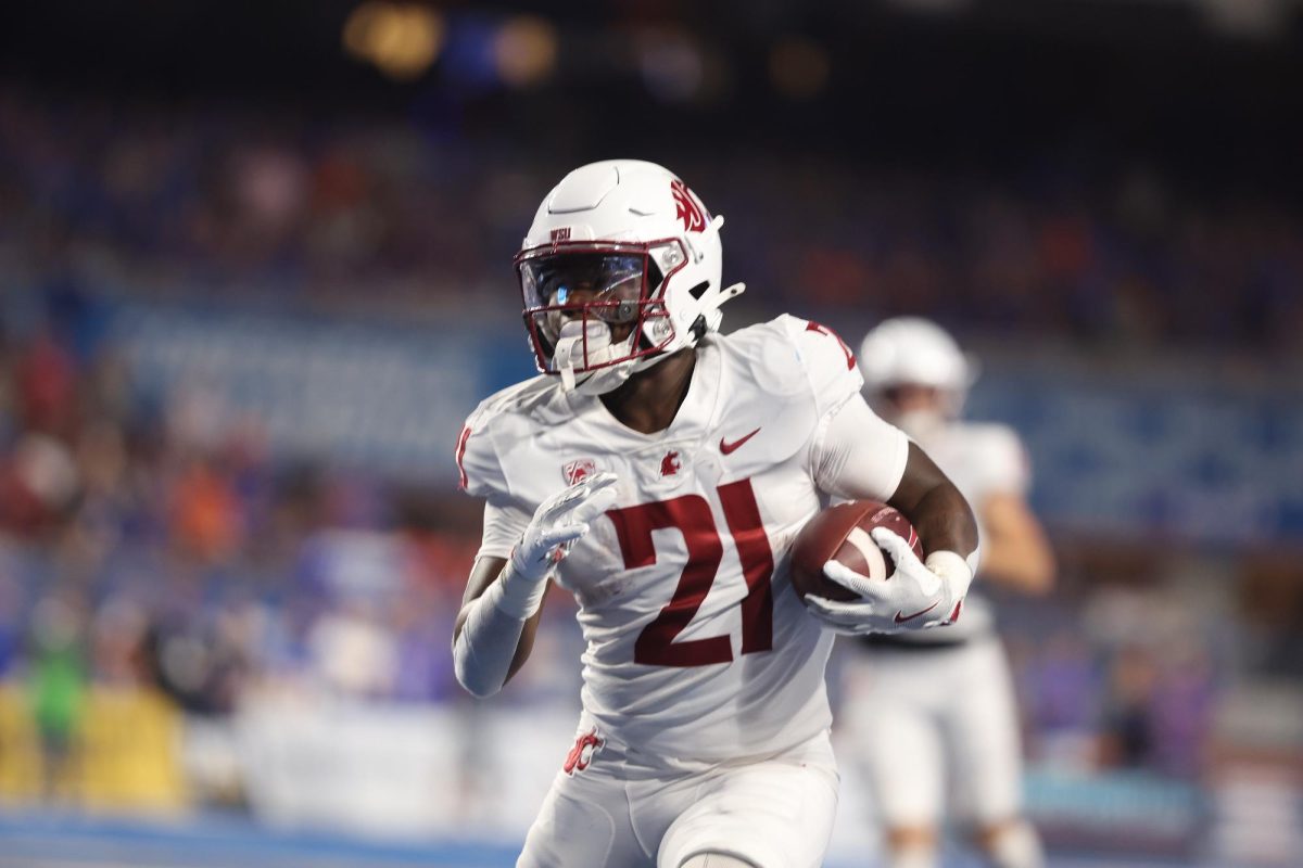 WSU Running Back Wayshawn Parker handling a carry.