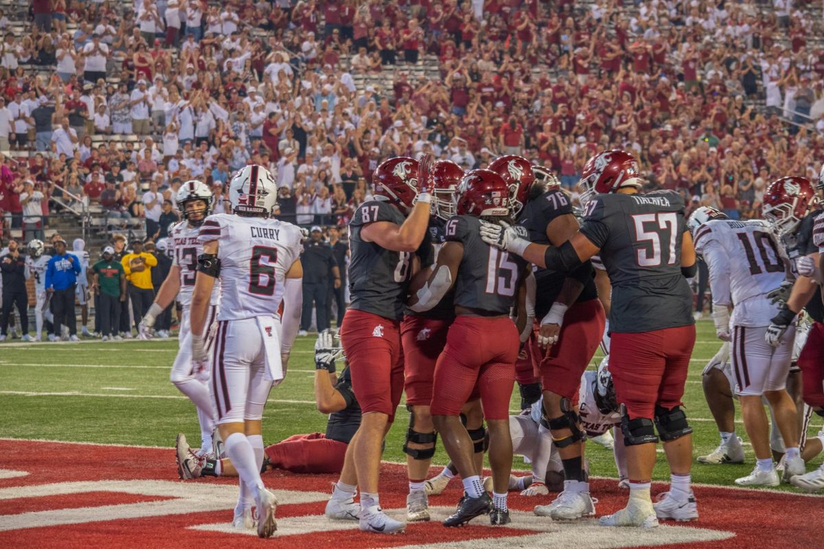 Running Back Djouvensky Schlenbaker celebrates a TD with his offensive line in a game against Texas Tech Universtiy.