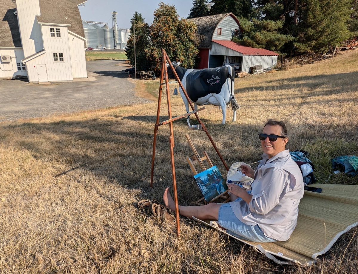 Rose Graham painting for Artisans at the Dahmen Barn's Plein Air Paint Out.