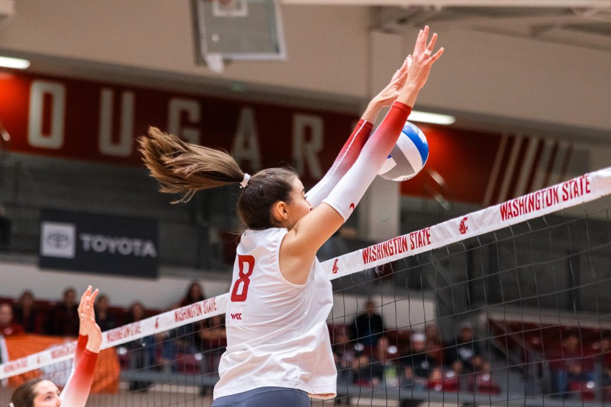 Katy Ryan stuffs a ball at the net against Portland, Oct. 2, in Pullman, Wash. 